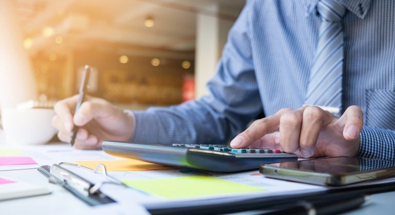 Image of a financial advisor at work to accompany a guest blog article from Nick Bone, Financial Advisor at Greenwood Mortgages, on the 60% tax trap and what higher earners need to know