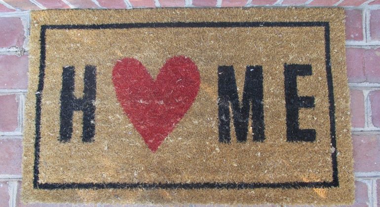 An image of a doormat with the word Home on it to support a new article from Jameson and Partners estate agents in Altrincham called Focus on these 6 Tips for success selling your home